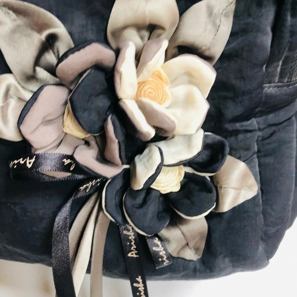 Arisha black super cute microfiber like fabric bag w/ attached flower detail